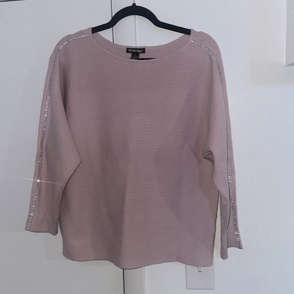 NWOT. Woman’s Bydesign purple sweater, with thin stoned line down sleeves.Size M